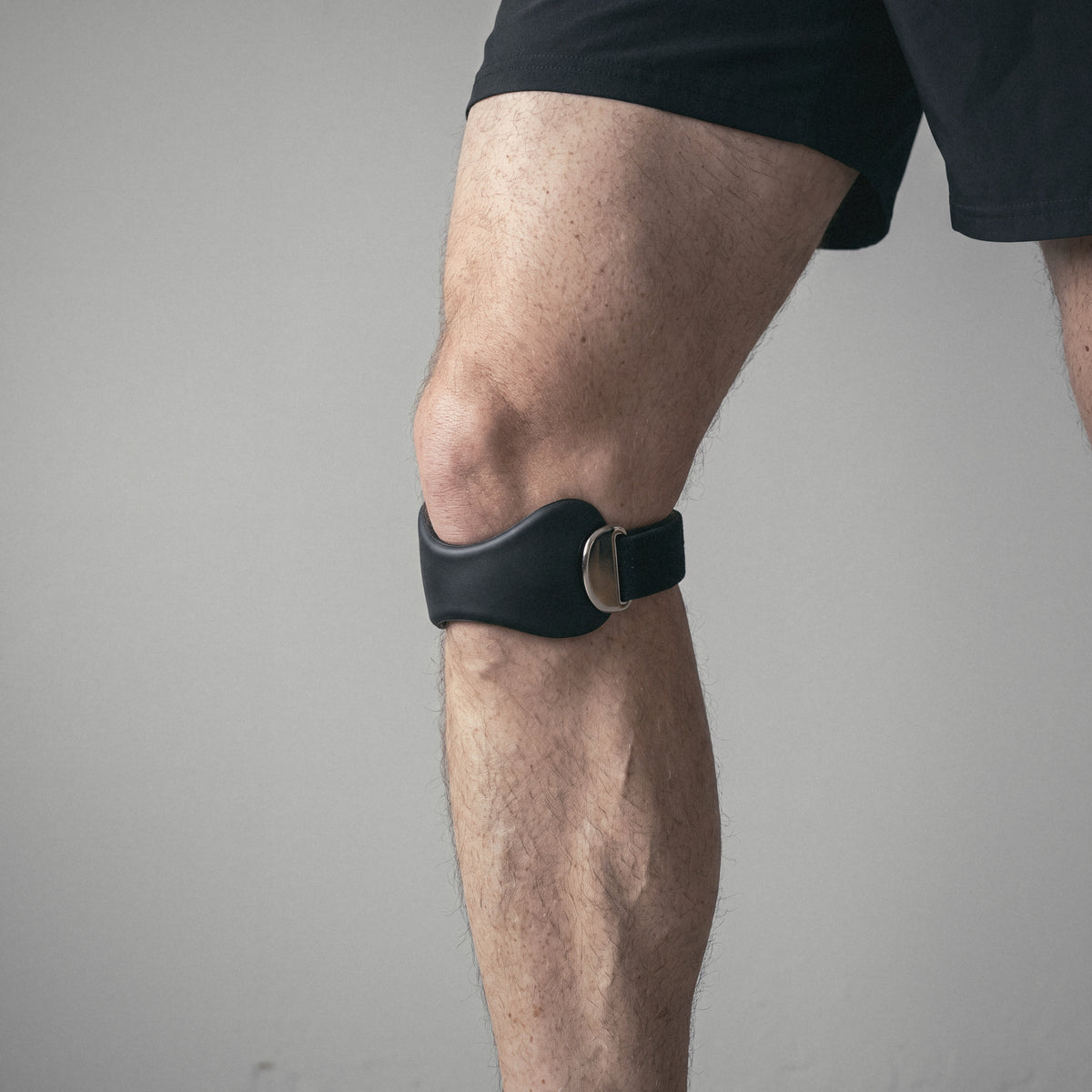 The OXYFIT Patella Strap just below the kneecap