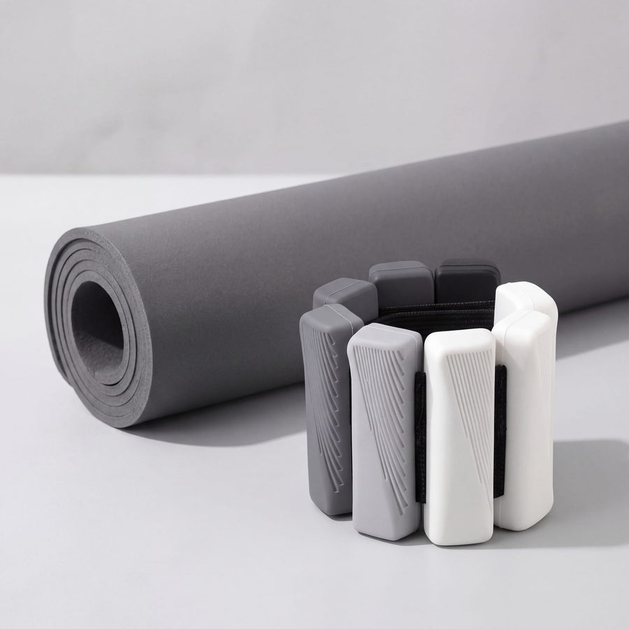 OXYFIT Wearable Weights in Slate Fade next to a rolled training mat