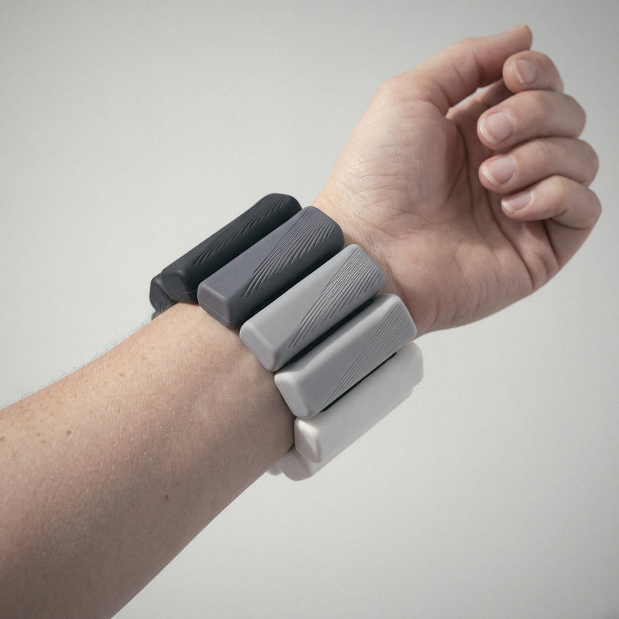 OXYFIT Wearable Weights in Slate Fade on a wrist