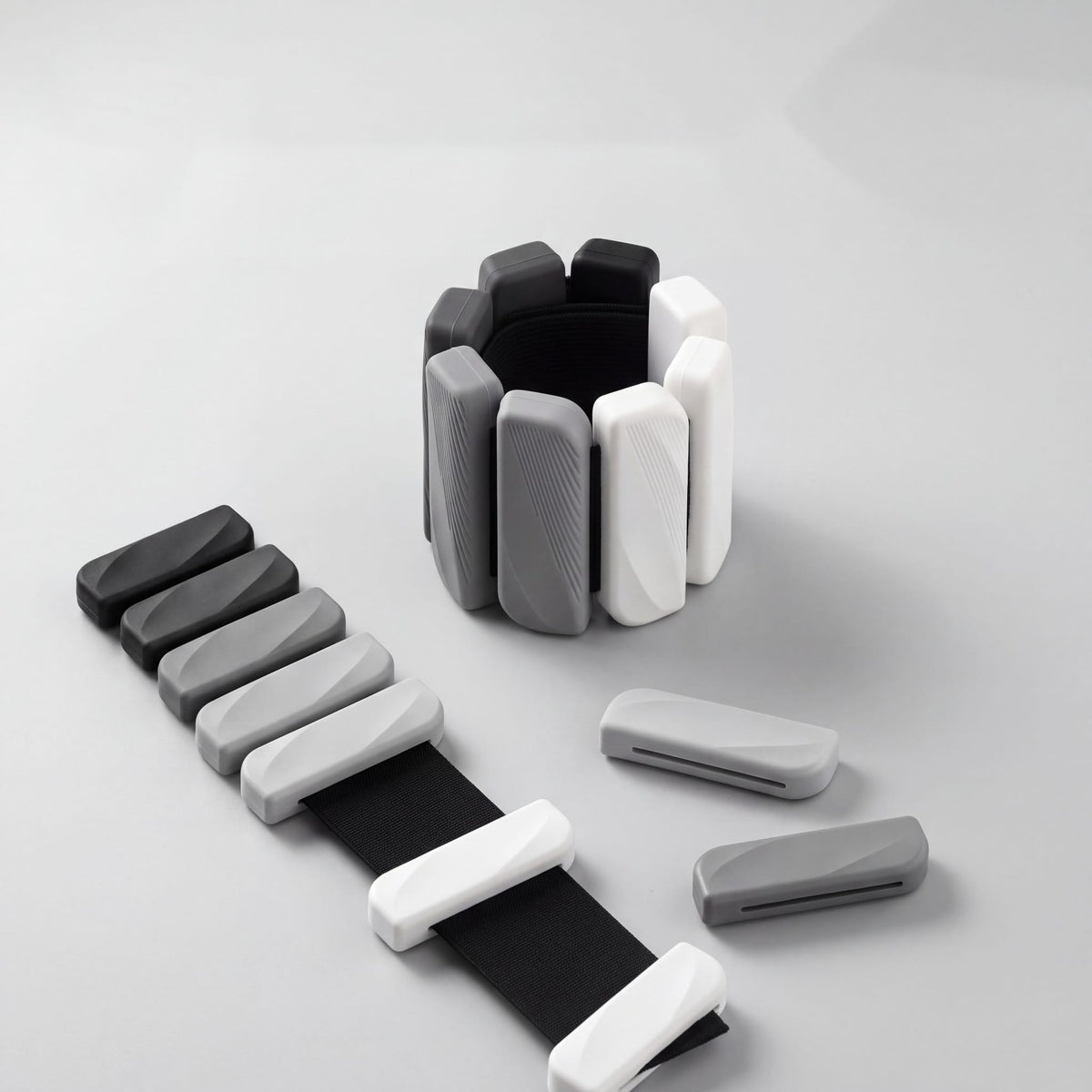 OXYFIT Wearable Weights in Slate Fade with two bars slid off the strap